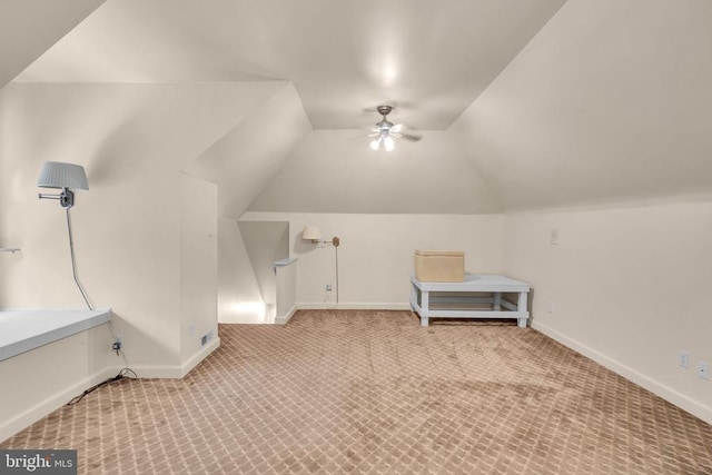  - additional living space with carpet flooring, a ceiling fan, and vaulted ceiling