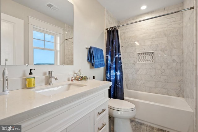  - full bath featuring vanity, shower / tub combo, and recessed lighting