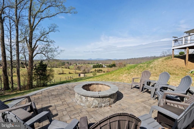  - view of patio with a fire pit and a mountain view