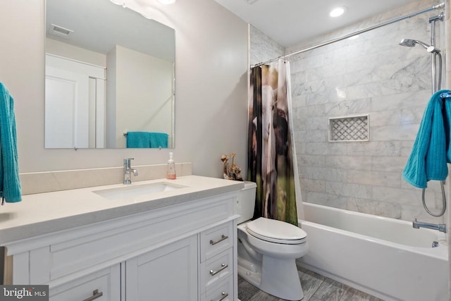  - bathroom with vanity, shower / tub combo with curtain, and wood finished floors