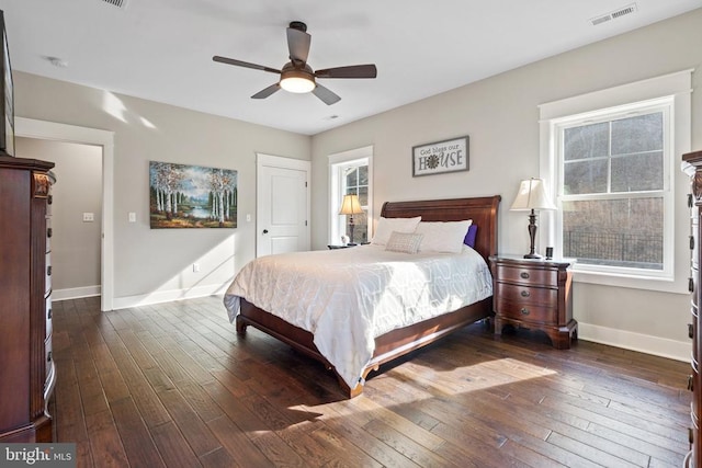  - bedroom with hardwood / wood-style floors, a ceiling fan, and a closet
