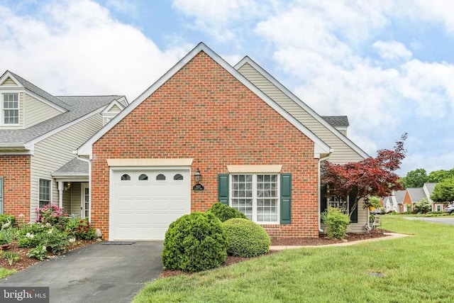 9301 Glascow Dr, Fredericksburg, VA 22408 - view of property exterior with brick siding, a garage, driveway, and a yard