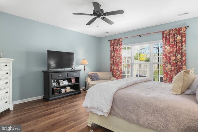 9301 Glascow Dr, Fredericksburg, VA 22408 - bedroom with dark wood finished floors, baseboards, and a ceiling fan