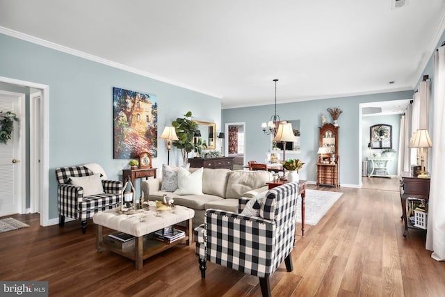 9301 Glascow Dr, Fredericksburg, VA 22408 - living area with crown molding, wood finished floors, a chandelier, and baseboards