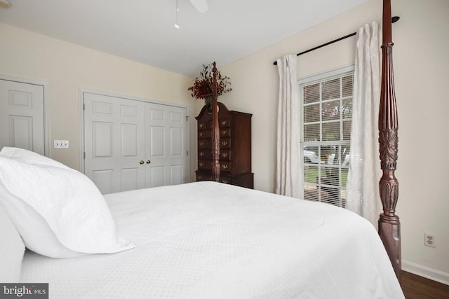 9301 Glascow Dr, Fredericksburg, VA 22408 - bedroom with baseboards, dark wood finished floors, a closet, and a ceiling fan