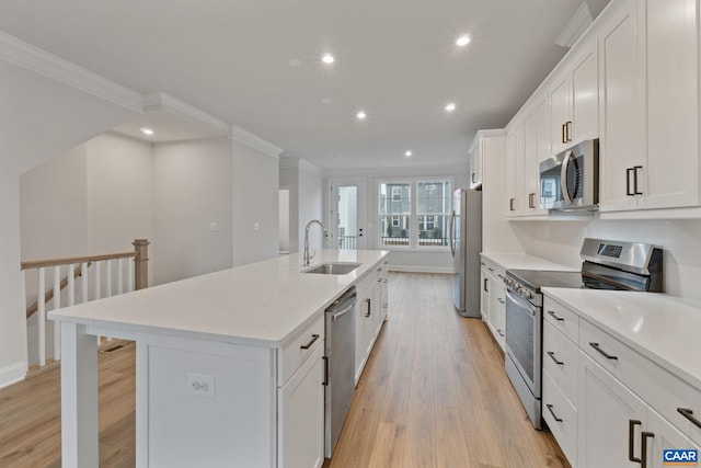 27 Woodburn Rd, Charlottesville, VA 22901 - kitchen featuring appliances with stainless steel finishes, ornamental molding, an island with sink, light wood finished floors, and recessed lighting