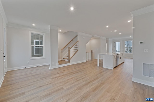 27 Woodburn Rd, Charlottesville, VA 22901 - unfurnished living room with ornamental molding, recessed lighting, light wood-type flooring, and stairway