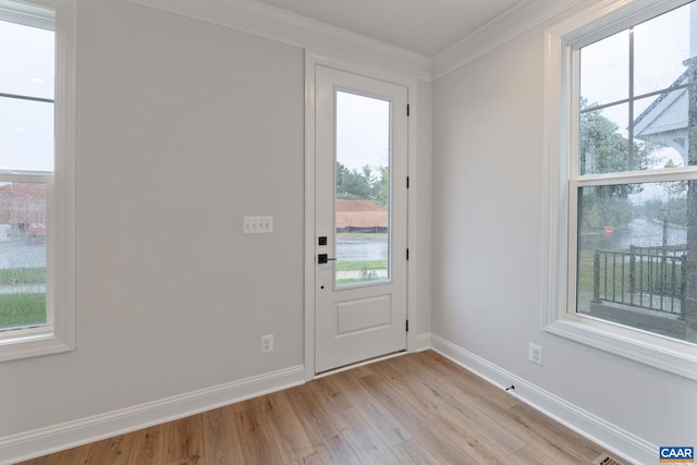 27 Woodburn Rd, Charlottesville, VA 22901 - doorway to outside featuring light wood-style flooring and crown molding