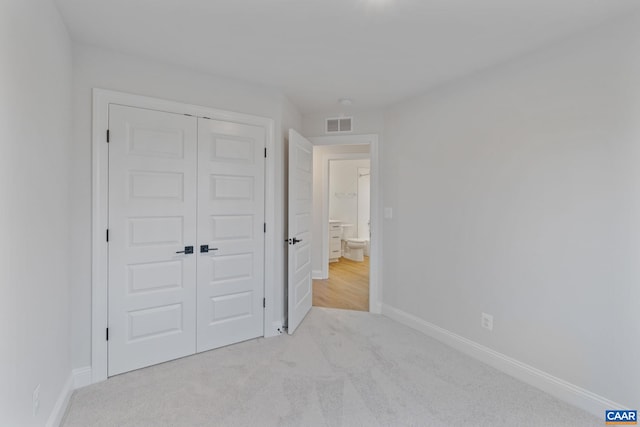 27 Woodburn Rd, Charlottesville, VA 22901 - unfurnished bedroom featuring carpet and a closet