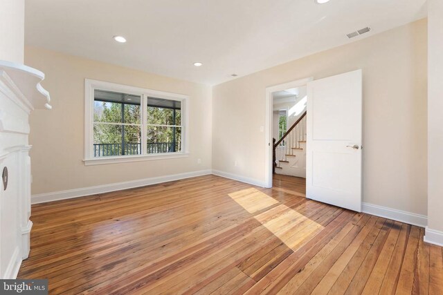 spare room featuring hardwood / wood-style flooring