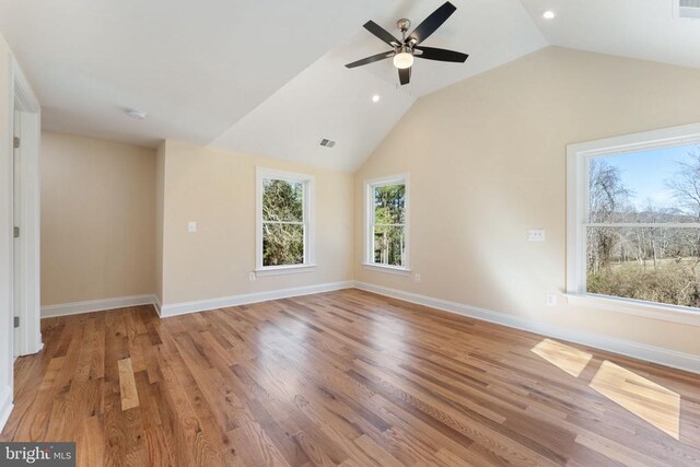 interior space featuring vaulted ceiling, ceiling fan, and light hardwood / wood-style flooring