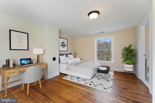 bedroom featuring dark hardwood / wood-style floors