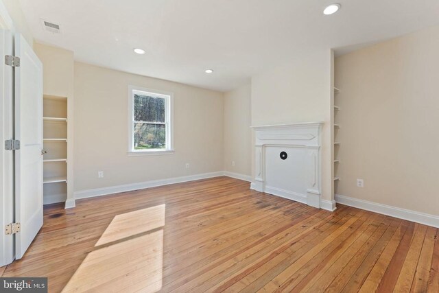 unfurnished living room with light wood-type flooring