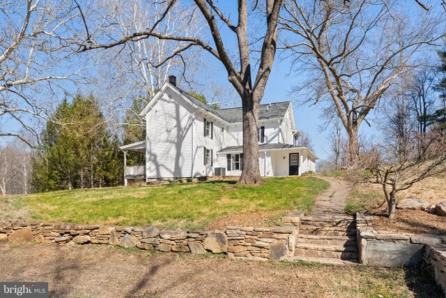 view of home's exterior featuring a lawn