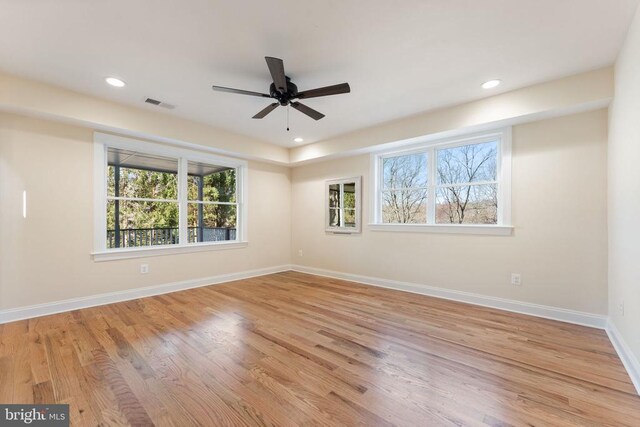 unfurnished room with ceiling fan and light hardwood / wood-style flooring