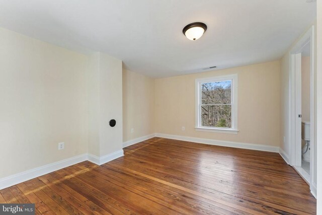 empty room with hardwood / wood-style floors