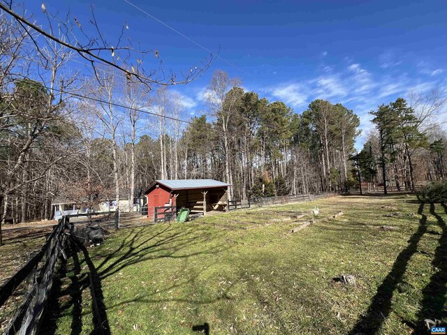3264 Martin Kings Rd, Charlottesville, VA 22903 - view of yard with an outbuilding, an outdoor structure, a forest view, and fence