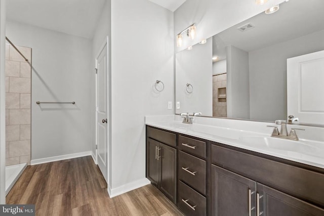 Kentuck Pl, Mineral, VA 23117 - bathroom with wood finished floors, double vanity, baseboards, and tiled shower
