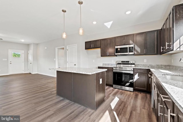 Kentuck Pl, Mineral, VA 23117 - kitchen with stainless steel appliances, wood finished floors, a sink, dark brown cabinetry, and recessed lighting