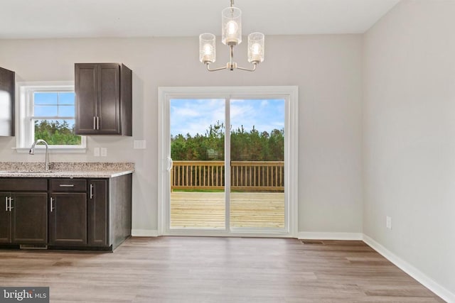 Kentuck Pl, Mineral, VA 23117 - entryway featuring a sink, a chandelier, light wood-style flooring, and baseboards
