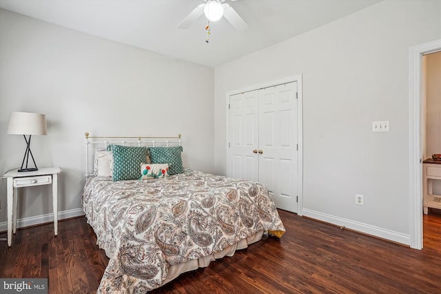 bedroom with baseboards, wood finished floors, a closet, and a ceiling fan