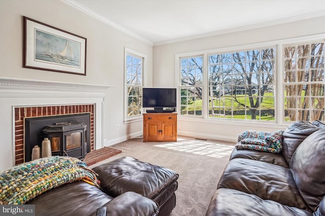 living area with carpet, baseboards, ornamental molding, and a wood stove