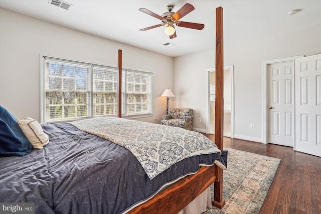 bedroom with wood finished floors, baseboards, and a ceiling fan