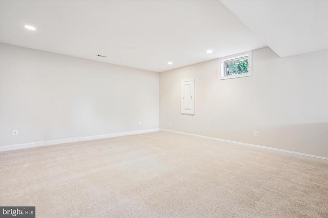 below grade area with recessed lighting, carpet floors, and baseboards