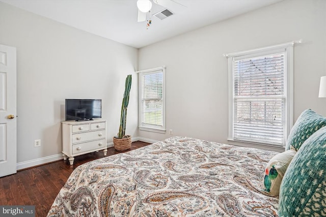 bedroom featuring dark wood-style floors, baseboards, and a ceiling fan