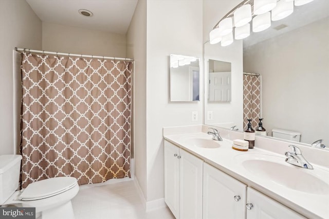 bathroom with toilet, double vanity, tile patterned flooring, and curtained shower