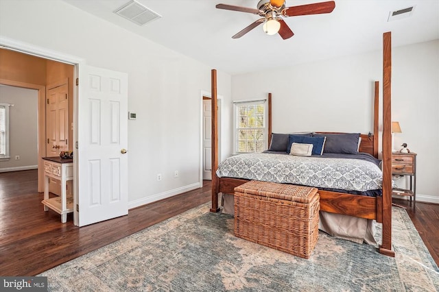 bedroom featuring wood finished floors, baseboards, and ceiling fan
