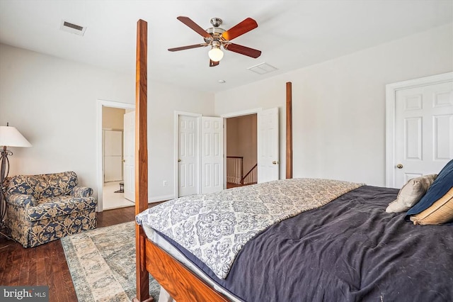 bedroom featuring wood finished floors, a ceiling fan, and connected bathroom