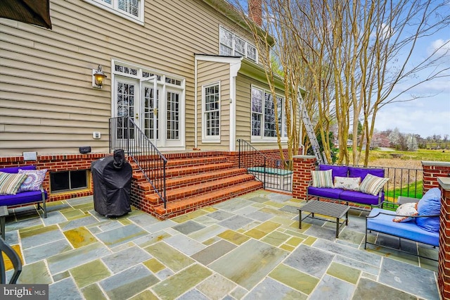 view of patio with an outdoor living space and entry steps