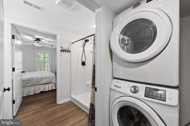 17114 Reid Hl, Culpeper, VA 22701 - laundry room with visible vents, laundry area, stacked washer and clothes dryer, and wood finished floors