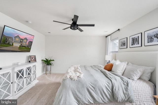 bedroom featuring carpet flooring, a ceiling fan, and baseboards