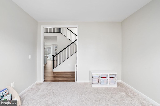 game room with carpet flooring and baseboards