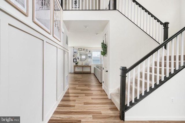 staircase featuring wood finished floors