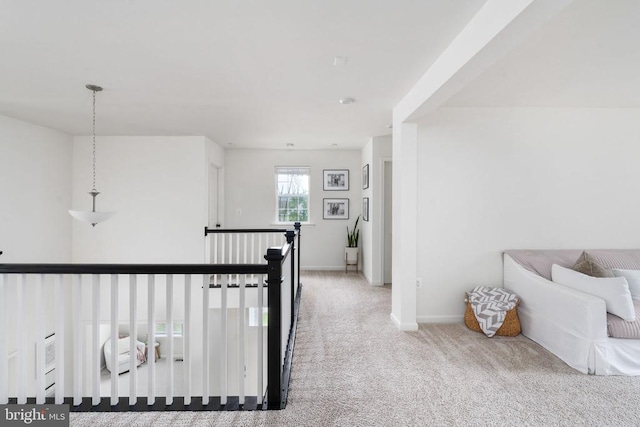corridor with carpet floors and baseboards