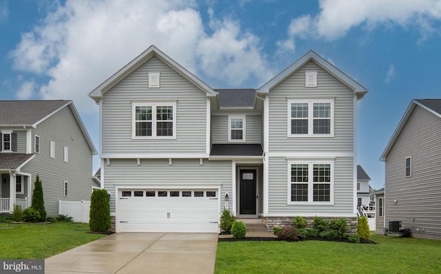 traditional-style house with driveway, a front lawn, an attached garage, and central air condition unit