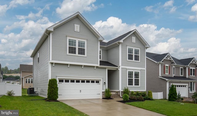 traditional home with a garage, concrete driveway, and central air condition unit
