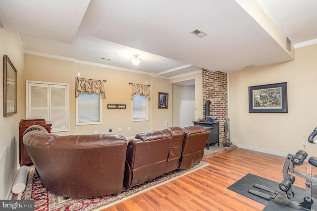 3617 Hidden Acres Way, Partlow, VA 22534 - living room featuring a wood stove, light wood-type flooring, and ornamental molding