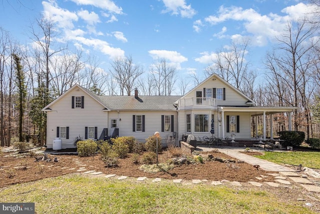 3617 Hidden Acres Way, Partlow, VA 22534 - view of front of home featuring a balcony, roof with shingles, a chimney, and covered porch