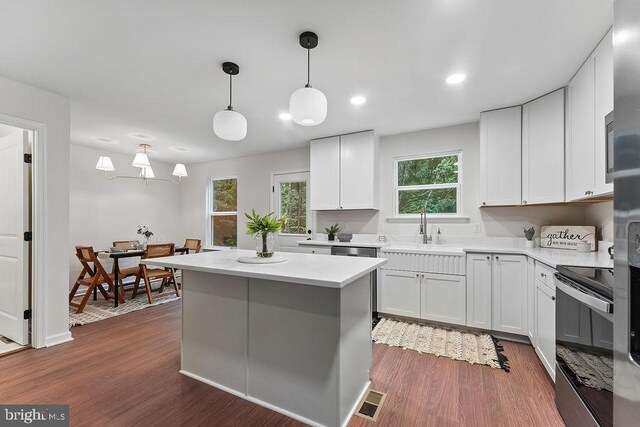 5925 Stubbs Bridge Rd, Mineral, VA 23117 - kitchen featuring stainless steel electric range oven, dark wood-style flooring, light countertops, a center island, and recessed lighting