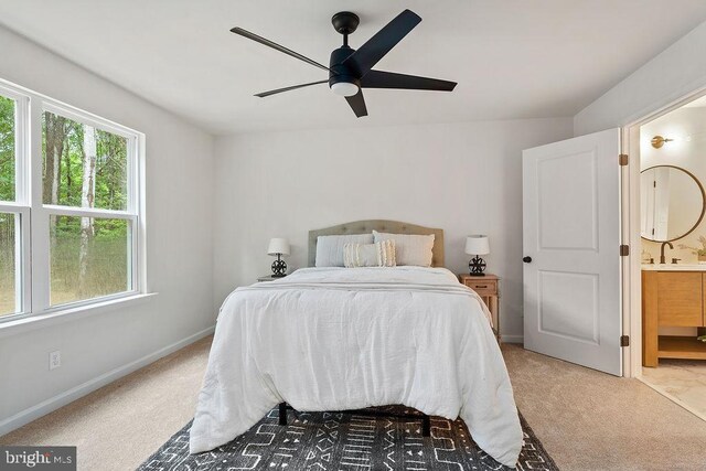 5925 Stubbs Bridge Rd, Mineral, VA 23117 - bedroom with light colored carpet, ensuite bathroom, and ceiling fan