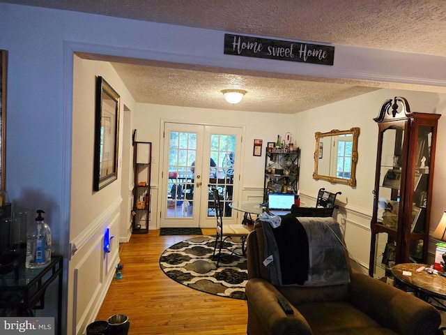 11708 Eisenhower Ln, Fredericksburg, VA 22407 - office area featuring a textured ceiling, french doors, and wood finished floors