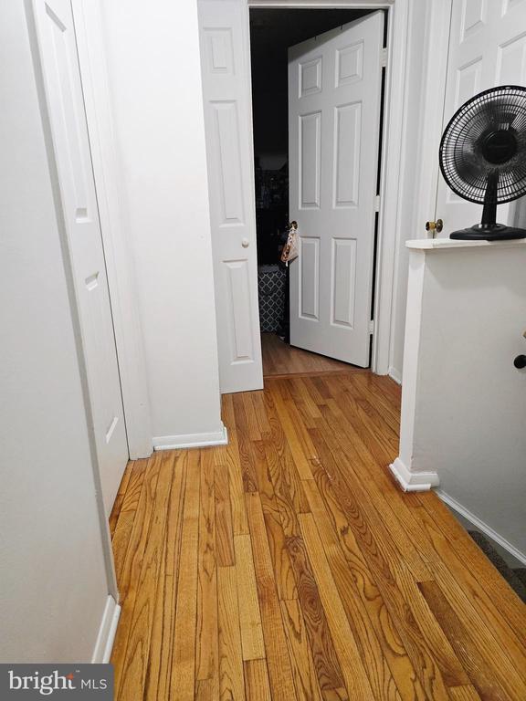 11708 Eisenhower Ln, Fredericksburg, VA 22407 - corridor with baseboards and light wood finished floors