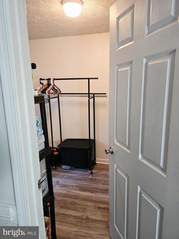 11708 Eisenhower Ln, Fredericksburg, VA 22407 - spacious closet featuring dark wood-style floors