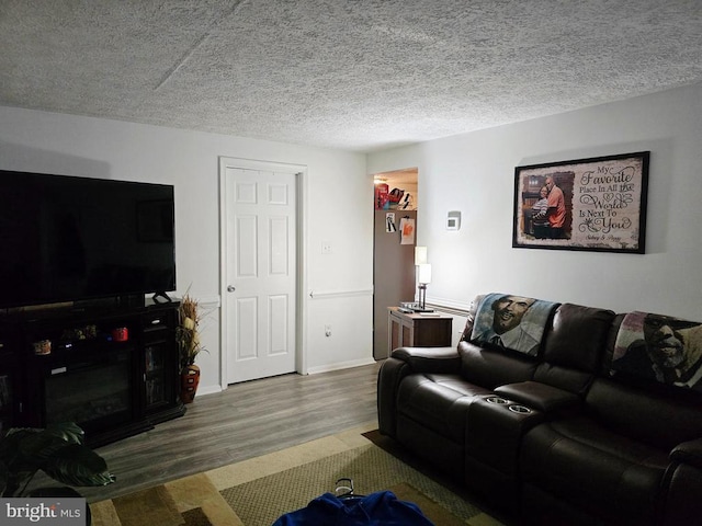 11708 Eisenhower Ln, Fredericksburg, VA 22407 - living room featuring wood finished floors and a textured ceiling