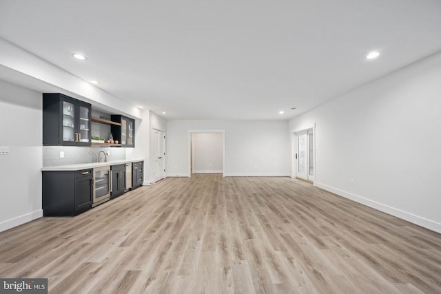 11606 Little Bay Harbor Way, Spotsylvania, VA 22551 - indoor wet bar with beverage cooler, recessed lighting, light wood finished floors, and backsplash