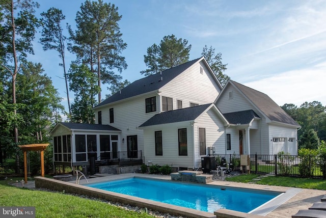 11606 Little Bay Harbor Way, Spotsylvania, VA 22551 - rear view of house featuring a sunroom, an attached garage, and a patio
